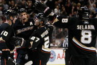 ANAHEIM, CA - NOVEMBER 19:  (L-R) Corey Perry #10, Ryan Getzlaf #15, Scott Niedermayer #27 and Teemu Selanne #8 of the Anaheim Ducks celebrate Niedermayer's game winning goal against the Tampa Bay Lightning at the Honda Center on November 19, 2009 in Anaheim, California. The Ducks defeated the Lightning 4-3 in overtime. (Photo by Jeff Gross/Getty Images)