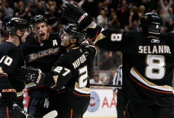 ANAHEIM, CA - NOVEMBER 19:  (L-R) Corey Perry #10, Ryan Getzlaf #15, Scott Niedermayer #27 and Teemu Selanne #8 of the Anaheim Ducks celebrate Niedermayer's game winning goal against the Tampa Bay Lightning at the Honda Center on November 19, 2009 in Anaheim, California. The Ducks defeated the Lightning 4-3 in overtime. (Photo by Jeff Gross/Getty Images)