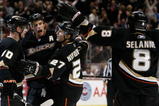 ANAHEIM, CA - NOVEMBER 19:  (L-R) Corey Perry #10, Ryan Getzlaf #15, Scott Niedermayer #27 and Teemu Selanne #8 of the Anaheim Ducks celebrate Niedermayer's game winning goal against the Tampa Bay Lightning at the Honda Center on November 19, 2009 in Anaheim, California. The Ducks defeated the Lightning 4-3 in overtime. (Photo by Jeff Gross/Getty Images)