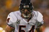 GREEN BAY, WI - SEPTEMBER 13: Brian Urlacher #54 of the Chicago Bears awaits the start of play in the 1st half against the Green Bay Packers on September 13, 2009 at Lambeau Field in Green Bay, Wisconsin. The Packers defeated the Bears 21-15. (Photo by Jonathan Daniel/Getty Images)
