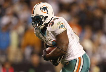 CHARLOTTE - NOVEMBER 19: Ricky Williams #34 of the Miami Dolphins scores on a 14 yard touchdown reception in the second quarter against the Carolina Panthers at Bank of America Stadium on November 19, 2009 in Charlotte, North Carolina.  (Photo by Streeter Lecka/Getty Images)
