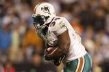 CHARLOTTE - NOVEMBER 19: Ricky Williams #34 of the Miami Dolphins scores on a 14 yard touchdown reception in the second quarter against the Carolina Panthers at Bank of America Stadium on November 19, 2009 in Charlotte, North Carolina.  (Photo by Streeter Lecka/Getty Images)