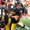 PITTSBURGH - NOVEMBER 15:  Quarterback Ben Roethlisberger #7 of the Pittsburgh Steelers looks to make a pass play while falling during their game against the Cincinnati Bengals at Heinz Field on November 15, 2009 in Pittsburgh, Pennsylvania. The Bengals defeated the Steelers 18-12. (Photo by Rick Stewart/Getty Images)