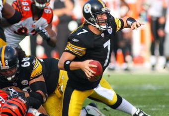 PITTSBURGH - NOVEMBER 15:  Quarterback Ben Roethlisberger #7 of the Pittsburgh Steelers looks to make a pass play while falling during their game against the Cincinnati Bengals at Heinz Field on November 15, 2009 in Pittsburgh, Pennsylvania. The Bengals defeated the Steelers 18-12. (Photo by Rick Stewart/Getty Images)