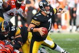 PITTSBURGH - NOVEMBER 15:  Quarterback Ben Roethlisberger #7 of the Pittsburgh Steelers looks to make a pass play while falling during their game against the Cincinnati Bengals at Heinz Field on November 15, 2009 in Pittsburgh, Pennsylvania. The Bengals defeated the Steelers 18-12. (Photo by Rick Stewart/Getty Images)
