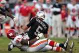 OAKLAND, CA - NOVEMBER 15:  Bruce Gradkowski #5 of the Oakland Raiders is sacked by Alex Magee #71 of the Kansas City Chiefs at Oakland-Alameda County Coliseum on November 15, 2009 in Oakland, California.  (Photo by Ezra Shaw/Getty Images)