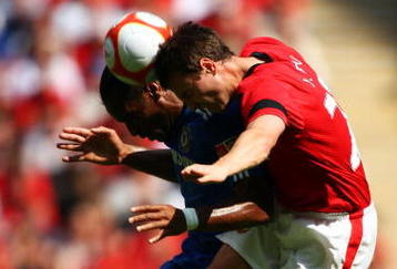 LONDON, ENGLAND - AUGUST 09:  Jonny Evans of Manchester United jumps with Didier Drogba of Chelsea  during the FA Community Shield match between Manchester United and Chelsea at Wembley Stadium on August 9, 2009 in London, England.  (Photo by Phil Cole/Getty Images)
