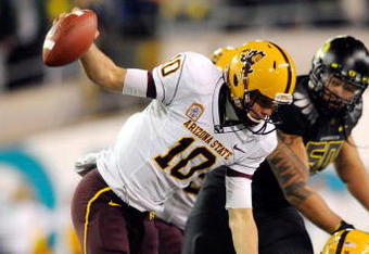 EUGENE,OR - NOVEMBER 14: Quarterback Samson Szakacsy #10 of the Arizona State Sun Devils is sacked by defensive end Terrell Turner #45 of the Oregon Ducks in the third quarter of the game at Autzen Stadium on November 14, 2009 in Eugene, Oregon. Oregon Defeated arizona State 44-21. (Photo by Steve Dykes/Getty Images)