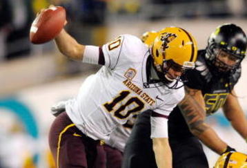 EUGENE,OR - NOVEMBER 14: Quarterback Samson Szakacsy #10 of the Arizona State Sun Devils is sacked by defensive end Terrell Turner #45 of the Oregon Ducks in the third quarter of the game at Autzen Stadium on November 14, 2009 in Eugene, Oregon. Oregon Defeated arizona State 44-21. (Photo by Steve Dykes/Getty Images)