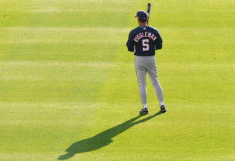 ATLANTA - APRIL 11: Coach Jim Reggleman #5 of the Washington Nationals casts a long shadow during batting practice before play against the Atlanta Braves on April 11, 2009 at Turner Field in Atlanta, Georgia.  (Photo by Al Messerschmidt/Getty Images) 