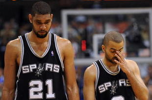 DALLAS - APRIL 25:  Forward Tim Duncan #21 and Tony Parker #9 of the San Antonio Spurs during a 99-90 loss against the Dallas Mavericks in Game Four of the Western Conference Quarterfinals during the 2009 NBA Playoffs at American Airlines Center on April 25, 2009 in Dallas, Texas. NOTE TO USER: User expressly acknowledges and agrees that, by downloading and or using this photograph, User is consenting to the terms and conditions of the Getty Images License Agreement.  (Photo by Ronald Martinez/Getty Images)
