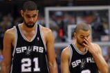 DALLAS - APRIL 25:  Forward Tim Duncan #21 and Tony Parker #9 of the San Antonio Spurs during a 99-90 loss against the Dallas Mavericks in Game Four of the Western Conference Quarterfinals during the 2009 NBA Playoffs at American Airlines Center on April 25, 2009 in Dallas, Texas. NOTE TO USER: User expressly acknowledges and agrees that, by downloading and or using this photograph, User is consenting to the terms and conditions of the Getty Images License Agreement.  (Photo by Ronald Martinez/Getty Images)