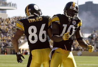 PITTSBURGH - OCTOBER 25:  Santonio Holmes #10 of the Pittsburgh Steelers celebrates with teammate Hines Ward #86 in the end zone during the NFL game against the Minnesota Vikings at Heinz Field on October 25, 2009 in Pittsburgh, Pennsylvania. The Steelers defeated the Vikings 27-17. (Photo by Rick Stewart/Getty Images)