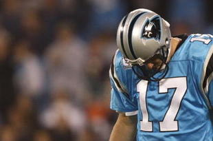 CHARLOTTE - NOVEMBER 19: Jake Delhomme #17 of the Carolina Panthers stabds on the field with his head down against the Miami Dolphins at Bank of America Stadium on November 19, 2009 in Charlotte, North Carolina.  (Photo by Streeter Lecka/Getty Images)