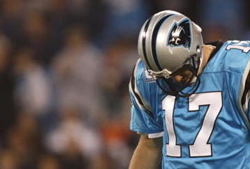 CHARLOTTE - NOVEMBER 19: Jake Delhomme #17 of the Carolina Panthers stabds on the field with his head down against the Miami Dolphins at Bank of America Stadium on November 19, 2009 in Charlotte, North Carolina.  (Photo by Streeter Lecka/Getty Images)