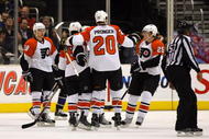 LOS ANGELES, CA - NOVEMBER 18:  Mike Richards #18 of the Philadelphia Flyers celebrates his second period goal against the Los Angeles Kings with teammates Chris Pronger #25, Claude Giroux #28 and Matt Carle #25 in the second period during the NHL game at the Staples Center on November 18, 2009 in Los Angeles, California.  (Photo by Victor Decolongon/Getty Images)