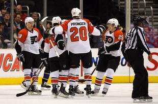 LOS ANGELES, CA - NOVEMBER 18:  Mike Richards #18 of the Philadelphia Flyers celebrates his second period goal against the Los Angeles Kings with teammates Chris Pronger #25, Claude Giroux #28 and Matt Carle #25 in the second period during the NHL game at the Staples Center on November 18, 2009 in Los Angeles, California.  (Photo by Victor Decolongon/Getty Images)