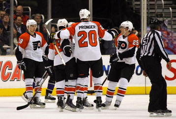 LOS ANGELES, CA - NOVEMBER 18:  Mike Richards #18 of the Philadelphia Flyers celebrates his second period goal against the Los Angeles Kings with teammates Chris Pronger #25, Claude Giroux #28 and Matt Carle #25 in the second period during the NHL game at the Staples Center on November 18, 2009 in Los Angeles, California.  (Photo by Victor Decolongon/Getty Images)