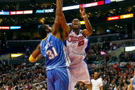 LOS ANGELES - NOVEMBER 26:  Marcus Camby #23 of the Los Angeles Clippers puts up a shot under pressure against Nene #31 of the Denver Nuggets during the game on November 26, 2008 at Staples Center in Los Angeles, California. The Nuggets won 106-105. NOTE TO USER: User expressly acknowledges and agrees that, by downloading and/or using this Photograph, user is consenting to the terms and conditions of the Getty Images License Agreement. (Photo by Jeff Gross/Getty Images)