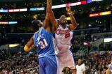 LOS ANGELES - NOVEMBER 26:  Marcus Camby #23 of the Los Angeles Clippers puts up a shot under pressure against Nene #31 of the Denver Nuggets during the game on November 26, 2008 at Staples Center in Los Angeles, California. The Nuggets won 106-105. NOTE TO USER: User expressly acknowledges and agrees that, by downloading and/or using this Photograph, user is consenting to the terms and conditions of the Getty Images License Agreement. (Photo by Jeff Gross/Getty Images)