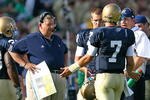 SOUTH BEND, IN - SEPTEMBER 19: Head coach Charlie Weis of the Notre Dame Fighting Irish talks with quarterback Jimmy Clausen #7 during a game against the Michigan State Spartans on September 19, 2009 at Notre Dame Stadium in South Bend, Indiana. (Photo by Jonathan Daniel/Getty Images)