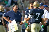 SOUTH BEND, IN - SEPTEMBER 19: Head coach Charlie Weis of the Notre Dame Fighting Irish talks with quarterback Jimmy Clausen #7 during a game against the Michigan State Spartans on September 19, 2009 at Notre Dame Stadium in South Bend, Indiana. (Photo by Jonathan Daniel/Getty Images)