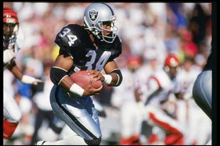 13 Jan 1991: Running back Bo Jackson of the Los Angeles Raiders runs down the field during a playoff game against the Cincinnati Bengals at the Los Angeles Coliseum in Los Angeles, California. The Raiders won the game 20-10.