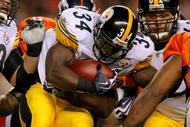 DENVER - NOVEMBER 09:  Rashard Mendenhall #34 of the Pittsburgh Steelers rushes against the Denver Broncos in the fourth quarter during NFL action at Invesco Field at Mile High on November 9, 2009 in Denver, Colorado. The Steelers defeated the Broncos 28-10.  (Photo by Doug Pensinger/Getty Images)
