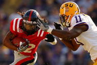 BATON ROUGE, LA - NOVEMBER 22:  Dexter McCluster #22 of the Ole Miss Rebels is tackled by Kelvin Sheppard #11 of the Louisiana State University Tigers on November 22, 2008 at Tiger Stadium in Baton Rouge, Louisiana.  (Photo by Chris Graythen/Getty Images)