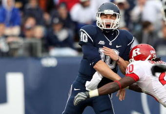 EAST HARTFORD, CT - OCTOBER 31:  Zach Frazer #10 of the Connecticut Huskies passes the ball under pressure from Khaseem Greene #20 of the Rutgers Scarlet Knights on October 31, 2009 at Rentschler Field in East Hartford, Connecticut. Rutgers defeated Connecticut 28-24.  (Photo by Elsa/Getty Images)
