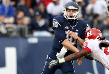 EAST HARTFORD, CT - OCTOBER 31:  Zach Frazer #10 of the Connecticut Huskies passes the ball under pressure from Khaseem Greene #20 of the Rutgers Scarlet Knights on October 31, 2009 at Rentschler Field in East Hartford, Connecticut. Rutgers defeated Connecticut 28-24.  (Photo by Elsa/Getty Images)