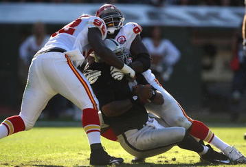 OAKLAND, CA - NOVEMBER 15:  Wallace Gilberry #92 and Tamba Hali #91 of the Kansas City Chiefs sack JaMarcus Russell #2 of the Oakland Raiders during an NFL game  at Oakland-Alameda County Coliseum on November 15, 2009 in Oakland, California.  (Photo by Jed Jacobsohn/Getty Images)