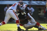 OAKLAND, CA - NOVEMBER 15:  Wallace Gilberry #92 and Tamba Hali #91 of the Kansas City Chiefs sack JaMarcus Russell #2 of the Oakland Raiders during an NFL game  at Oakland-Alameda County Coliseum on November 15, 2009 in Oakland, California.  (Photo by Jed Jacobsohn/Getty Images)