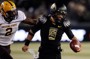 EUGENE,OR - NOVEMBER 14: Quarterback Jeremiah Masoli #8 of the Oregon Ducks outruns safety Ryan McFoy #2 in the third quarter of the game at Autzen Stadium on November 14, 2009 in Eugene, Oregon. Oregon Defeated arizona State 44-21. (Photo by Steve Dykes/Getty Images)