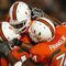 FORT LAUDERDALE, FL - OCTOBER 03: Wide receiver Travis Benjamin #3 of the Miami Hurricanes celebrates his touchdown with teammates Joel Figueroa #61 and Orlando Franklin #74 against the Oklahoma Sooners at Land Shark Stadium on October 3, 2009 in Fort Lauderdale, Florida. Miami defeated Oklahoma 21-20. (Photo by Doug Benc/Getty Images)