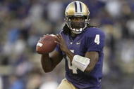 SEATTLE - SEPTEMBER 23:  Quarterback Isaiah Stanback #4 of the Washington Huskies rolls out during the game against the UCLA Bruins on September 23, 2006 at Husky Stadium in Seattle Washington. The Huskies won 29-19. (Photo by Otto Greule Jr/Getty Images) 