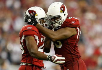 GLENDALE, AZ - NOVEMBER 15:  Beanie Wells (L) #26 of the Arizona Cardinals celebrates a touchdown with Bertrand Berry #93 in the second half against the Seattle Seahawks at University of Phoenix Stadium on November 15, 2009 in Glendale, Arizona. The Cardinals defeated the Seahawks 31-20.  (Photo by Jeff Gross/Getty Images)