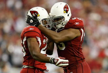 GLENDALE, AZ - NOVEMBER 15:  Beanie Wells (L) #26 of the Arizona Cardinals celebrates a touchdown with Bertrand Berry #93 in the second half against the Seattle Seahawks at University of Phoenix Stadium on November 15, 2009 in Glendale, Arizona. The Cardinals defeated the Seahawks 31-20.  (Photo by Jeff Gross/Getty Images)