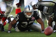 OAKLAND, CA - NOVEMBER 15: Tyvon Branch #33 of the Oakland Raiders looks at a fumbled ball against the Kansas City Chiefs during an NFL game at Oakland-Alameda County Coliseum on November 15, 2009 in Oakland, California.  (Photo by Jed Jacobsohn/Getty Images)