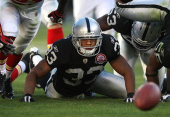 OAKLAND, CA - NOVEMBER 15: Tyvon Branch #33 of the Oakland Raiders looks at a fumbled ball against the Kansas City Chiefs during an NFL game at Oakland-Alameda County Coliseum on November 15, 2009 in Oakland, California.  (Photo by Jed Jacobsohn/Getty Images)