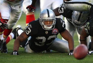 OAKLAND, CA - NOVEMBER 15: Tyvon Branch #33 of the Oakland Raiders looks at a fumbled ball against the Kansas City Chiefs during an NFL game at Oakland-Alameda County Coliseum on November 15, 2009 in Oakland, California.  (Photo by Jed Jacobsohn/Getty Images)