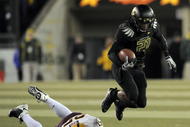 EUGENE,OR - NOVEMBER 14: Running back LaMichael James #21of the Oregon Ducks leaps over the the tackle of linebacker Mike Nixon #25 of the Arizona State Sun Devils in the first quarter of the game at Autzen Stadium on November 14, 2009 in Eugene, Oregon. James has 118 yards and 3 touchdowns in the first half of the game. (Photo by Steve Dykes/Getty Images)