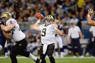 ST. LOUIS - NOVEMBER 15:  Quarterback Drew Brees #9 of the New Orleans Saints passes the ball during the game against the St. Louis Rams at the Edward Jones Dome on November 15, 2009 in St. Louis, Missouri.  (Photo by Dilip Vishwanat/Getty Images)