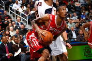 ATLANTA - NOVEMBER 20:  Joe Johnson #2 of the Atlanta Hawks defends against Trevor Ariza #1 of the Houston Rockets at Philips Arena on November 20, 2009 in Atlanta, Georgia.  NOTE TO USER: User expressly acknowledges and agrees that, by downloading and/or using this Photograph, User is consenting to the terms and conditions of the Getty Images License Agreement.  (Photo by Kevin C. Cox/Getty Images)