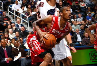 ATLANTA - NOVEMBER 20:  Joe Johnson #2 of the Atlanta Hawks defends against Trevor Ariza #1 of the Houston Rockets at Philips Arena on November 20, 2009 in Atlanta, Georgia.  NOTE TO USER: User expressly acknowledges and agrees that, by downloading and/or using this Photograph, User is consenting to the terms and conditions of the Getty Images License Agreement.  (Photo by Kevin C. Cox/Getty Images)
