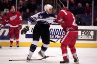 3 Mar 2001: Stu Grimson #32 of the Los Angeles Kings gets into a fight with Darren McCarty #25 of the Detroit Red Wings during the game at the STAPLES Center in Los Angeles, California. The Kings defeated the Red Wings 6-3.Mandatory Credit: Kellie Landis /Allsport