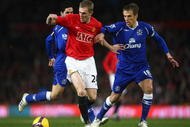 MANCHESTER, UNITED KINGDOM - JANUARY 31:  Darren Fletcher of Manchester United tussles for posession with Phil Neville of Everton during the Barclays Premier League match between Manchester United and Everton at Old Trafford on January 31, 2009 in Manchester, England. (Photo by Jamie McDonald/Getty Images)