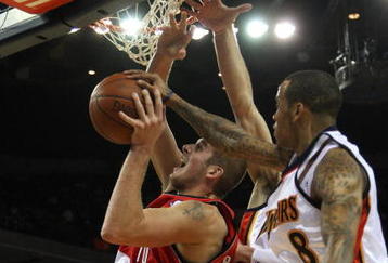OAKLAND, CA - NOVEMBER 20:  Monta Ellis #8 of the Golden State Warriors defends against Joel Przybilla #10 of the Portland Trail Blazers during an NBA game at Oracle Arena on November 20, 2009 in Oakland, California.  (Photo by Jed Jacobsohn/Getty Images)
