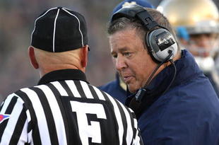 SOUTH BEND, IN - OCTOBER 17: Head coach Charlie Weis of the Notre Dame Fighting Irish talks with a referee during a game against the USC Trojans at Notre Dame Stadium on October 17, 2009 in South Bend, Indiana. USC defeated Notre Dame 34-27. (Photo by Jonathan Daniel/Getty Images)