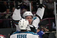 NEW YORK - OCTOBER 19: Dany Heatley #15 of the San Jose Sharks scores a first period goal against Steve Valiquette #40 of the New York Rangers and is joined by Ryan Vesce #53 at Madison Square Garden on October 19, 2009 in New York City.  (Photo by Bruce Bennett/Getty Images)